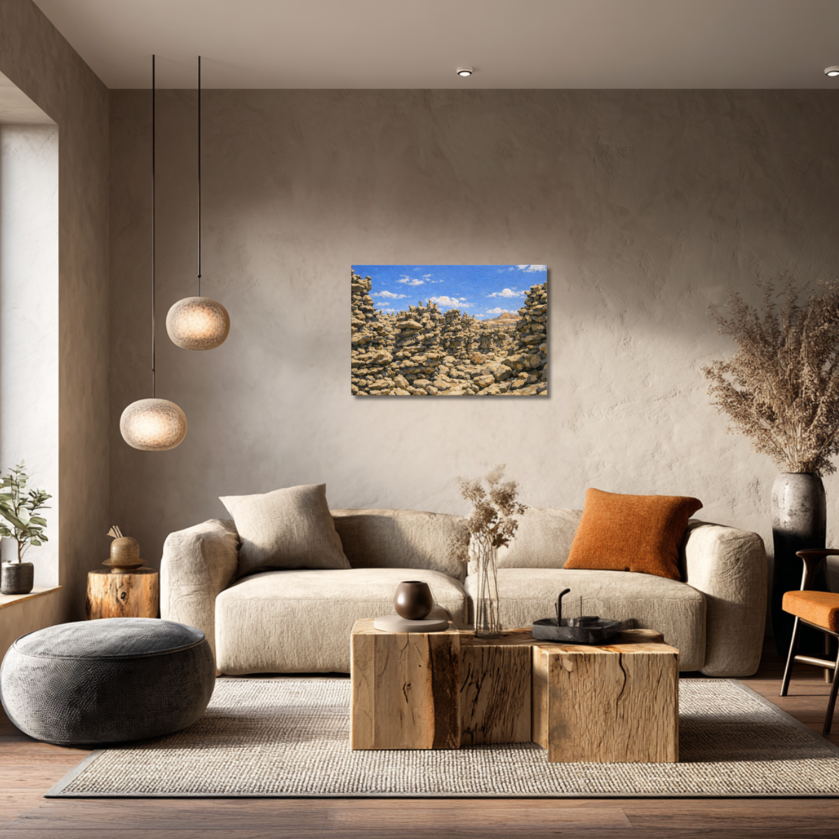 Modern living room with a beige sofa, wooden coffee table, and canvas wall art of Fantasy Canyon during the day.