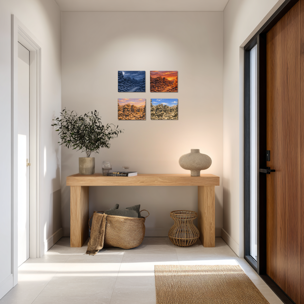 Modern interior with a wooden console table, decorative items, and four canvas wall art of Fantasy Canyon, one for each time of day.