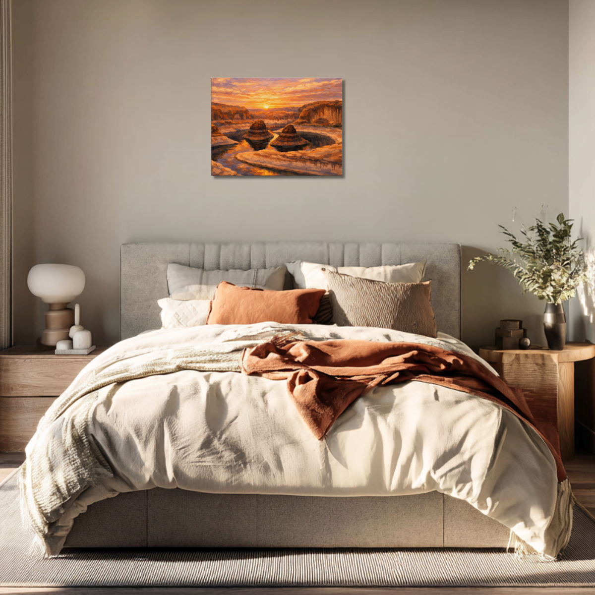 Cozy bedroom with a bed, nightstands, and canvas wall art of a sunset landscape at Reflection Canyon. 