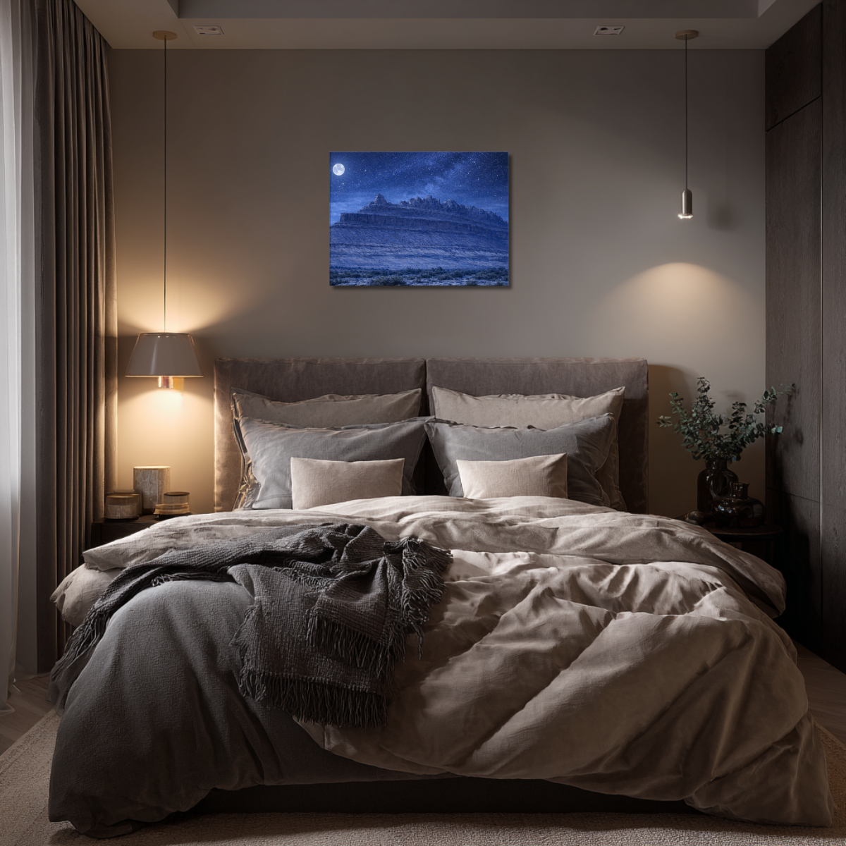 Modern bedroom with a bed, nightstands, and wall art canvas print of the Rock Ship formation during nighttime at Black Dragon Canyon.