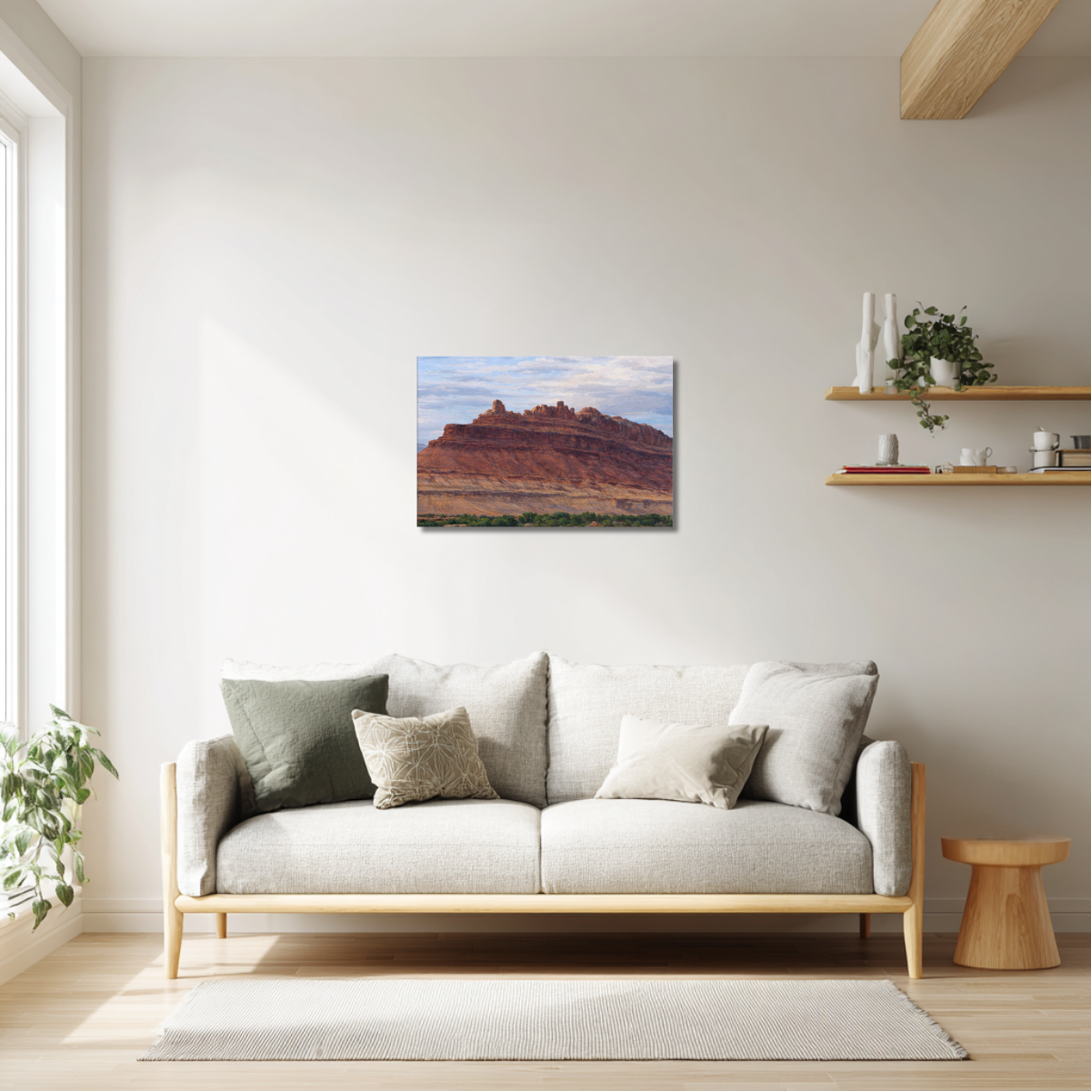 Framed canvas print of the Rock Ship formation at Black Dragon Canyon hanging on a living room wall above a neutral modern sofa, surrounded by warm wood accents, soft lighting, and minimalist décor.